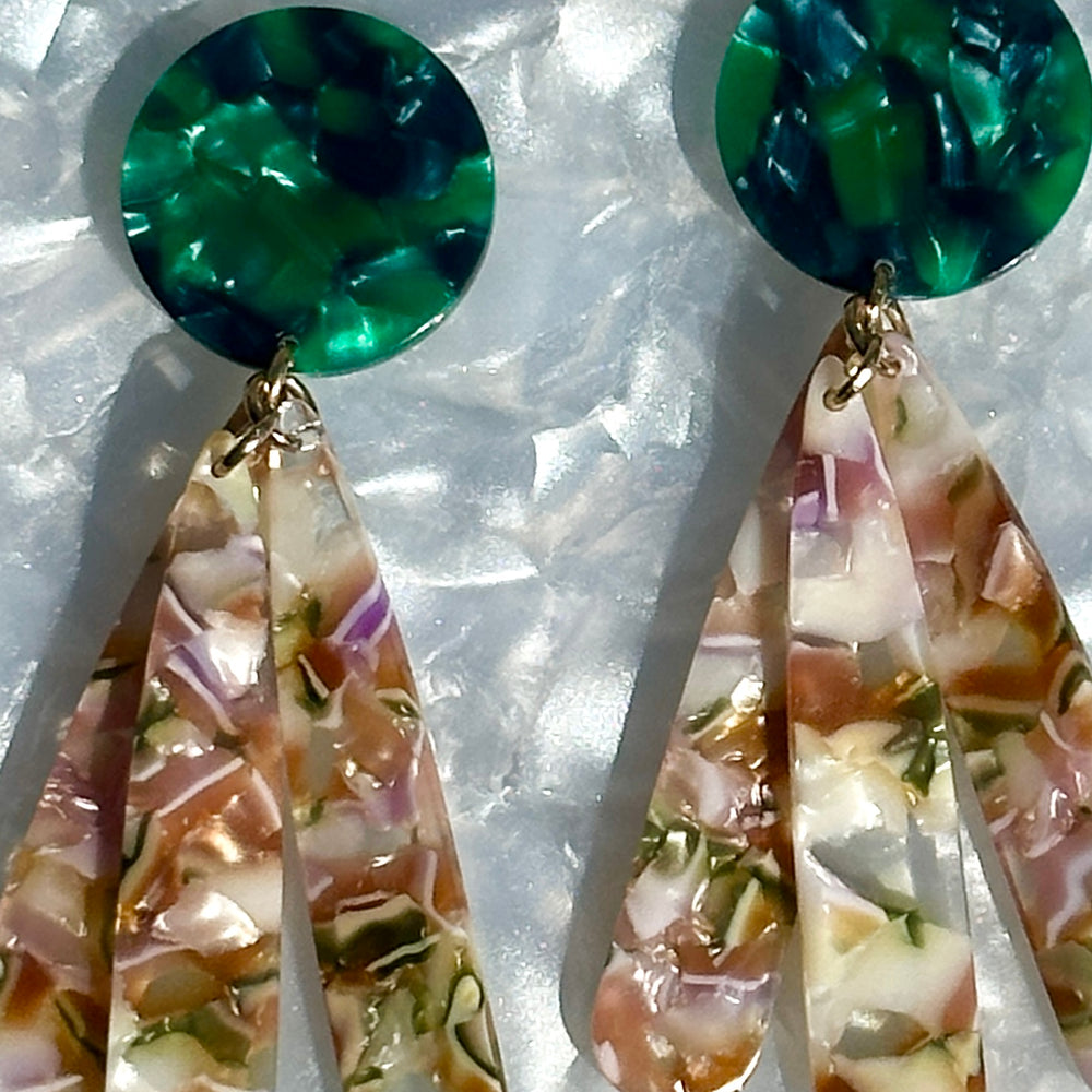 close up of acrylic flower Petal Drop Earrings in green, purple and brown