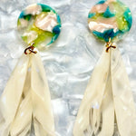 close up of acrylic flower Petal Drop Earrings in iridescent cream, blue, green and pink