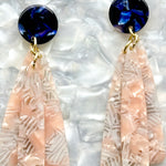 close up of acrylic flower Petal Drop Earrings in light pink and navy