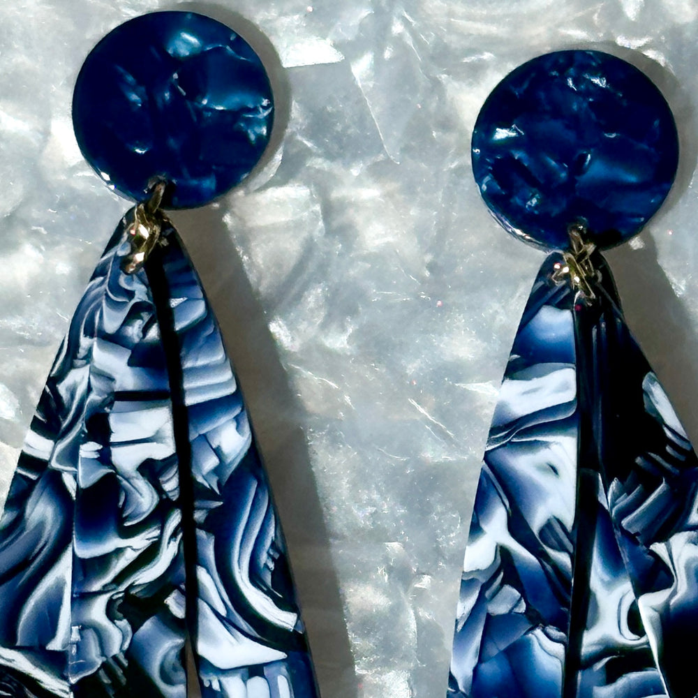 close up of acrylic flower Petal Drop Earrings in navy blue