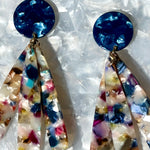 close up of acrylic flower Petal Drop Earrings in navy, green, white and magenta