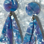 close up of acrylic flower Petal Drop Earrings in periwinkle, blue, purple