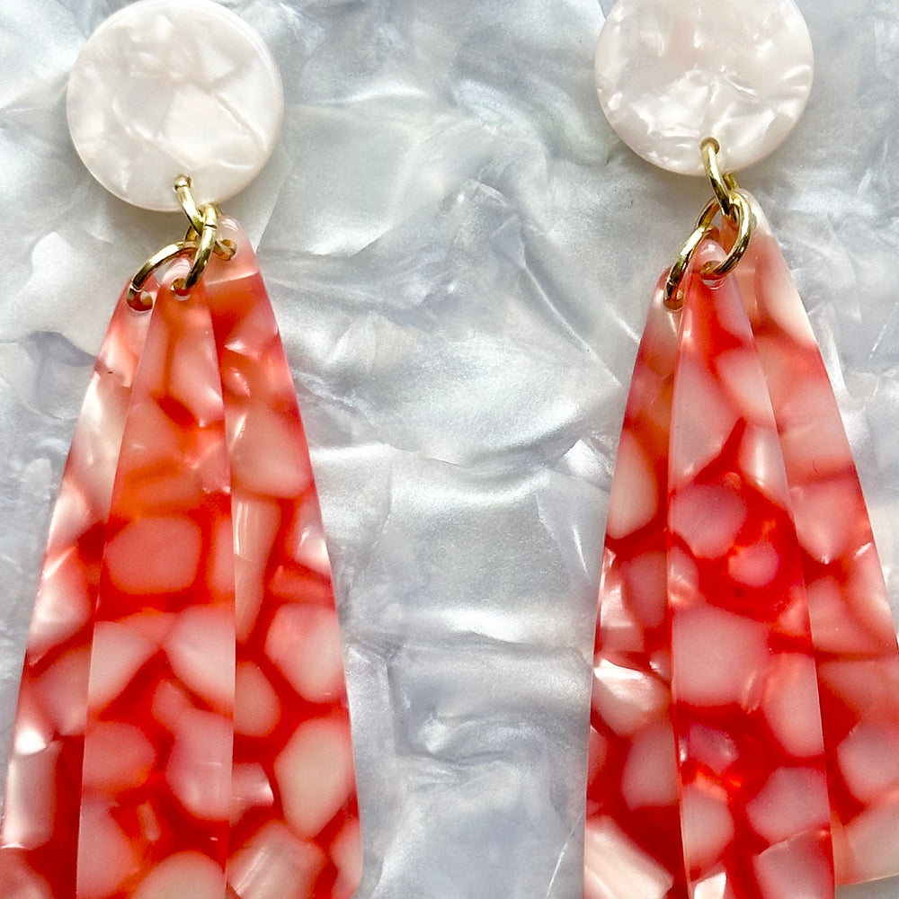 close up of acrylic flower Petal Drop Earrings in red and white