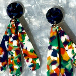 close up of acrylic flower Petal Drop Earrings in red, white, yellow, blue and green