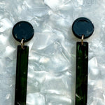 close up of acrylic matchstick earrings in black