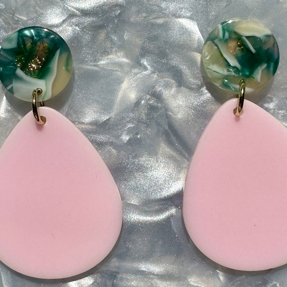 close up of mini acrylic teardrop earring in pink and green and cream 