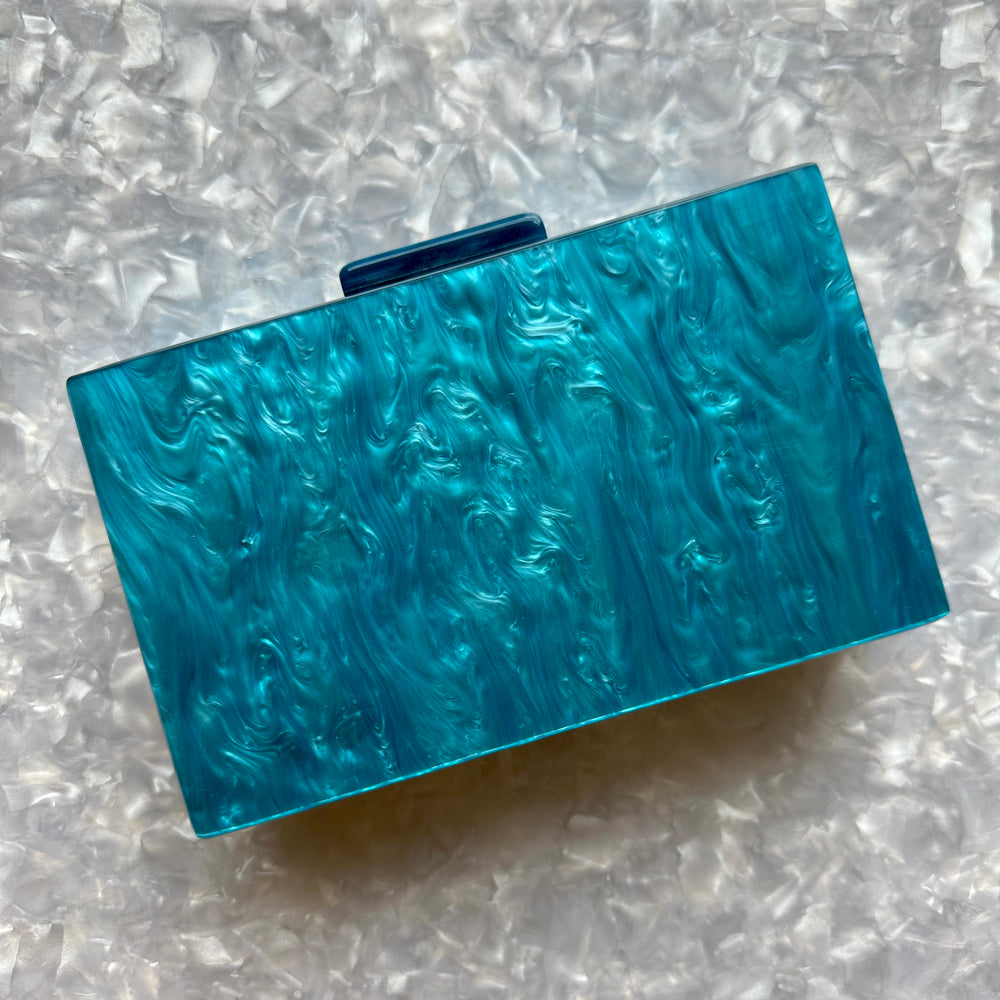 clutch purse in blue acrylic