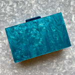 clutch purse in blue acrylic