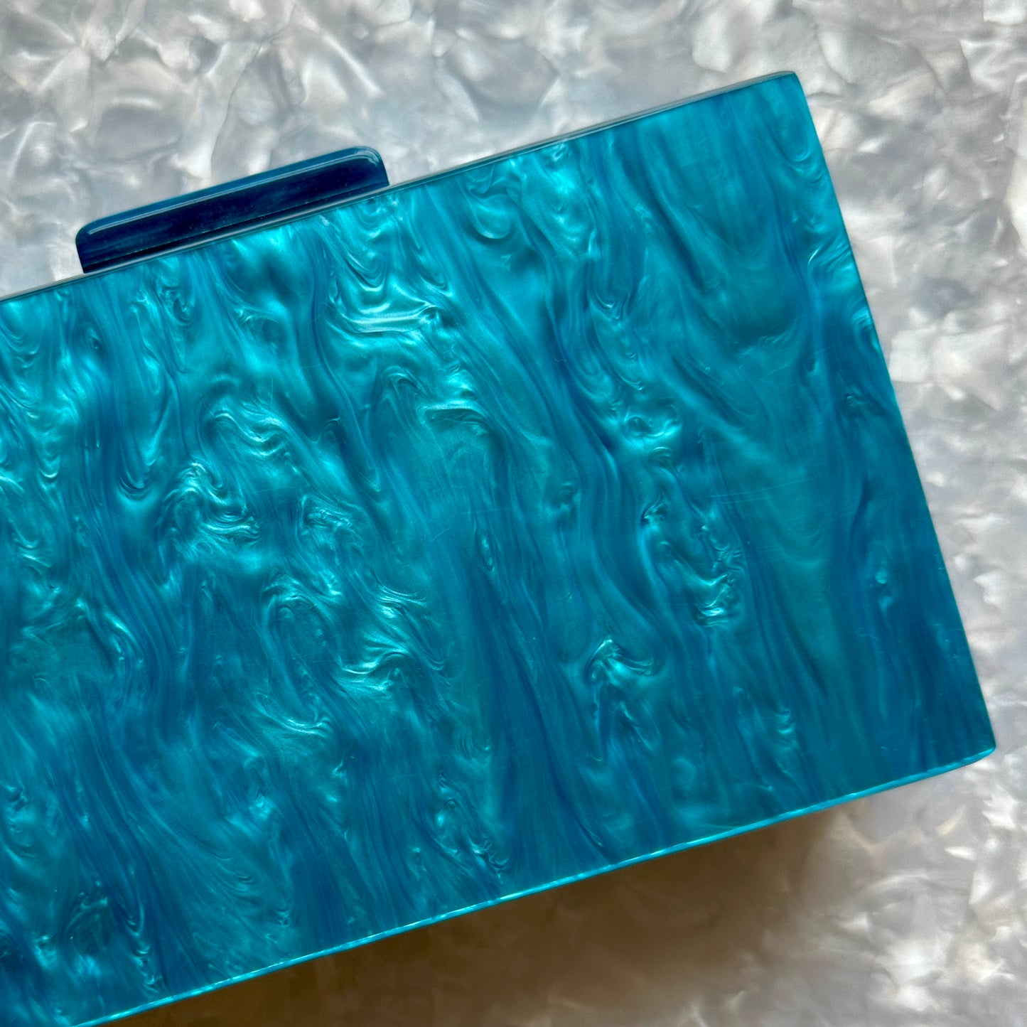 clutch purse in blue acrylic_close up