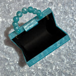 clutch purse with beaded handle in light blue acrylic_interior