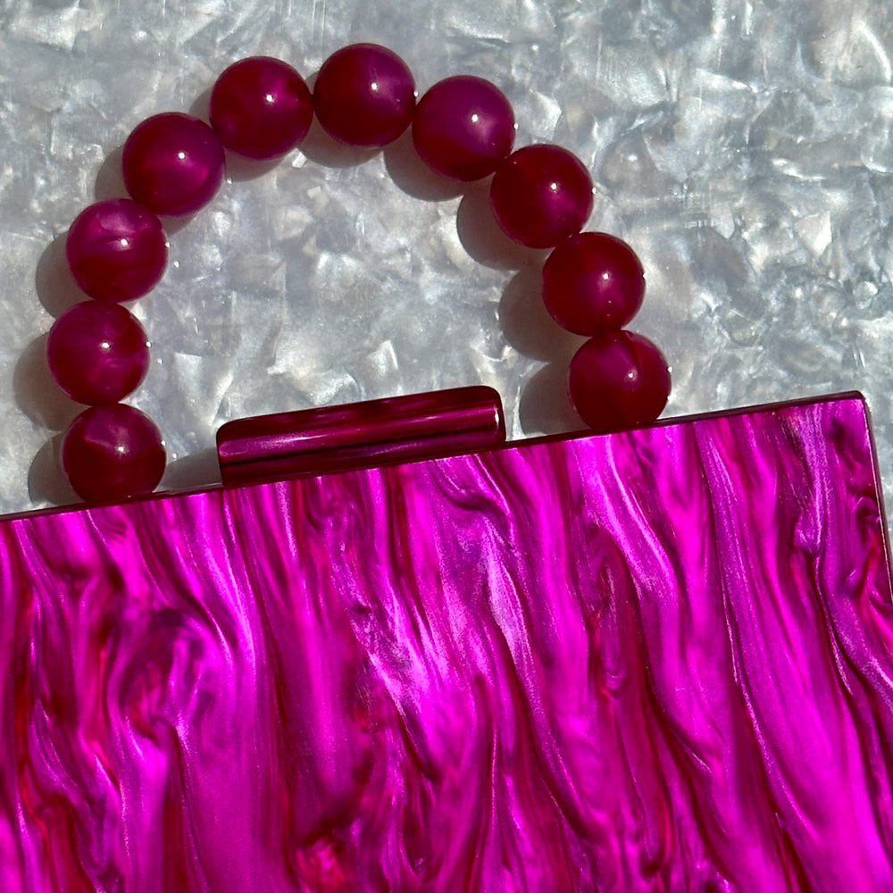 clutch purse with beaded handle in magenta pink acrylic_close up