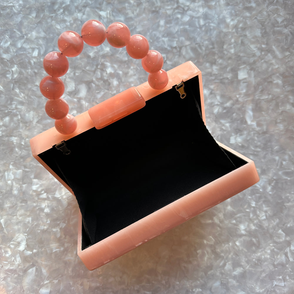 clutch purse with beaded handle in peach pink acrylic_interior