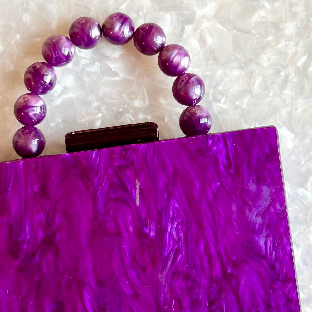 clutch purse with beaded handle in purple acrylic_interior