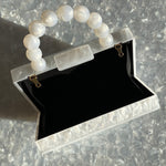 clutch purse with beaded handle in white acrylic_interior