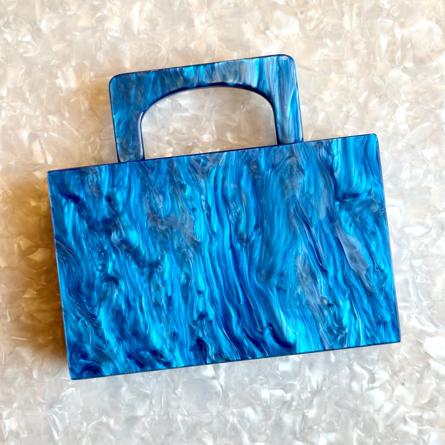 clutch purse with handle in blue acrylic