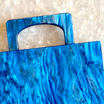 clutch purse with handle in blue acrylic_interior