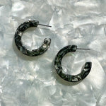 mini acrylic hoop earrings in a mix of black, gray, and white 