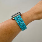 side view of woman wearing acrylic Apple Watch Band in License to Thrill blue