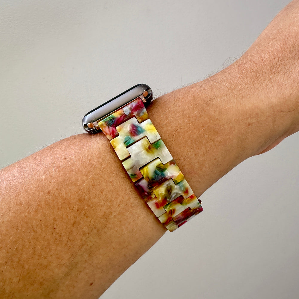 side view of woman wearing acrylic Apple Watch Band in Light Multicolor