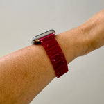 side view of woman wearing acrylic Apple Watch Band in Strawberry red