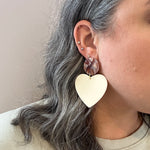 woman wearing Acrylic Heart Earrings in Bare My Love and cream 