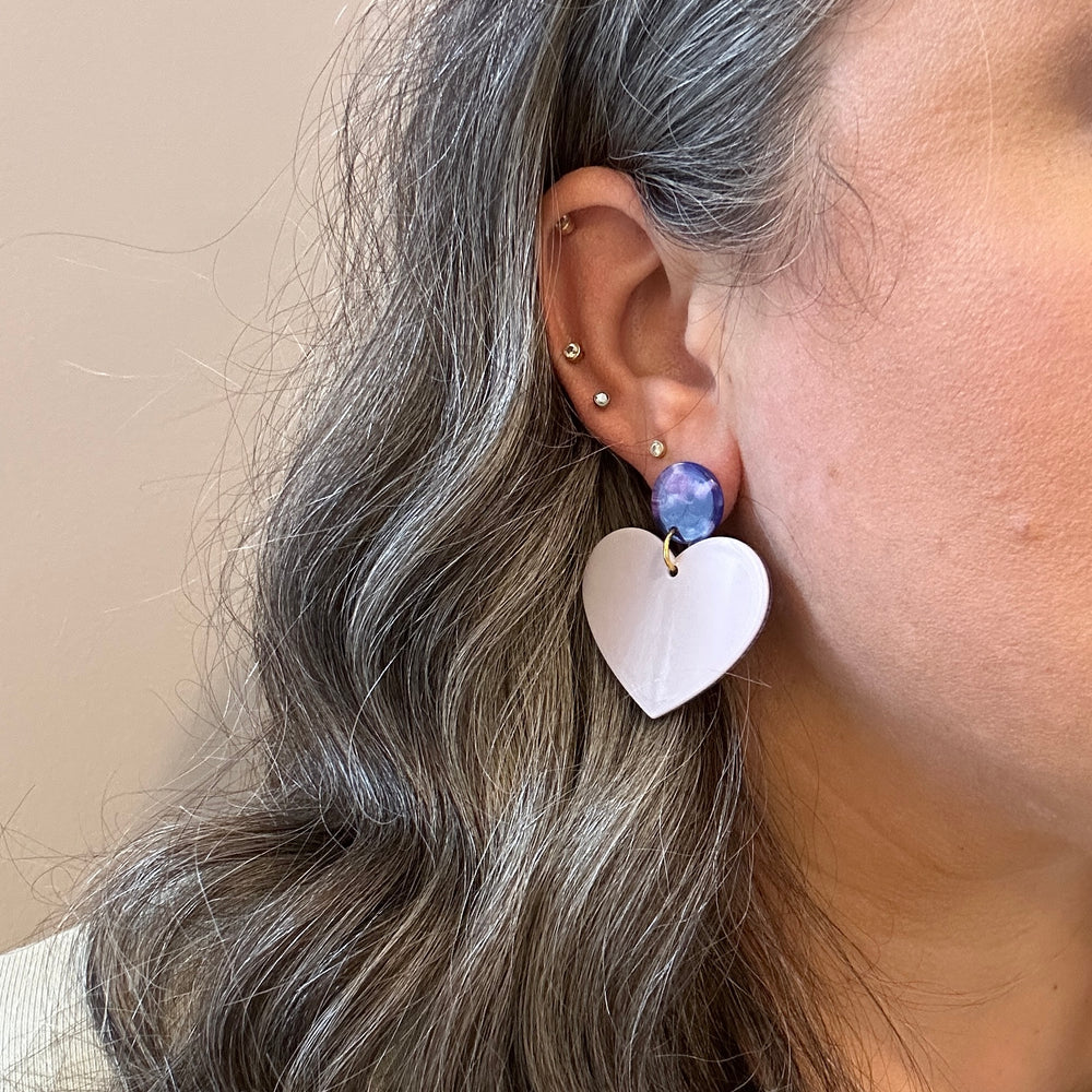 woman wearing  Acrylic Heart Earrings in Lilac You A Lot and deep purple 