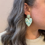 woman wearing Acrylic Heart Earrings in Mint To Be, light blue, green, and white 