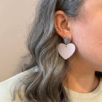 woman wearing  Acrylic Heart Earrings in So In Love, purple and light blue 