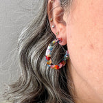 woman wearing  Acrylic Hoop Earrings in Multicolor 