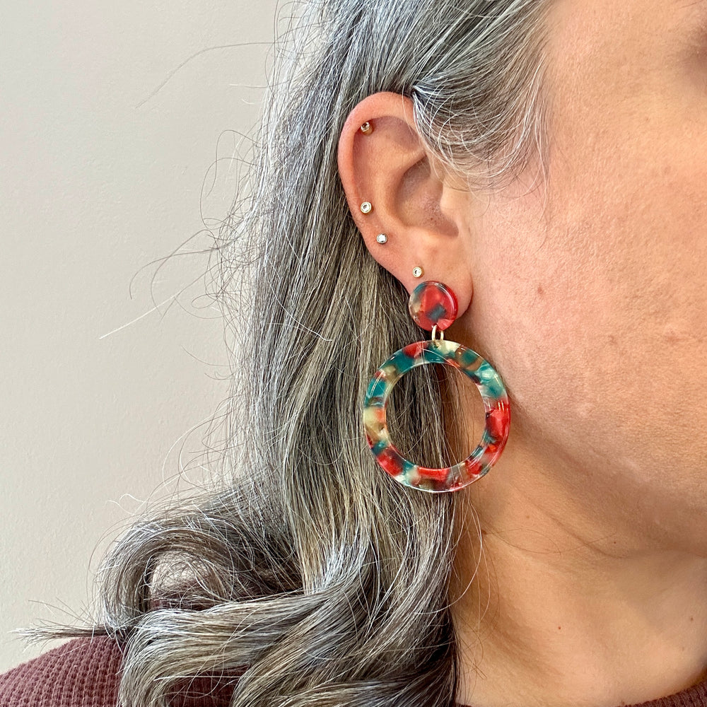 woman wearing Acrylic open circle drop in red, green and yellow 