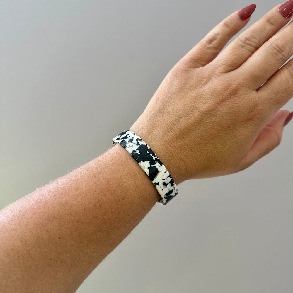 woman wearing Medium acrylic Cuff in black and white