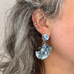 woman wearing Mini acrylic flower Petal Drop Earrings in blue