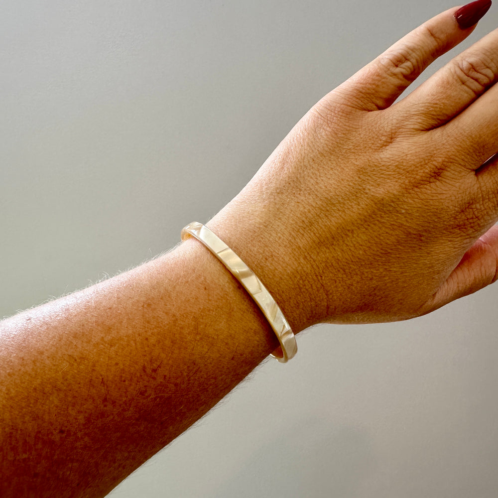 woman wearing Skinny acrylic Cuff in Pearly Beige