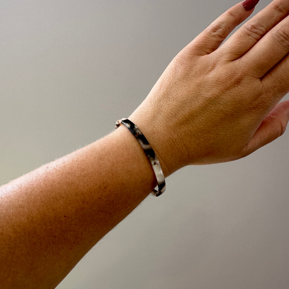 woman wearing Skinny acrylic Cuff in Pearly Tortoise