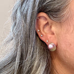 woman wearing a Acrylic stud earring in  purple, green and yellow 