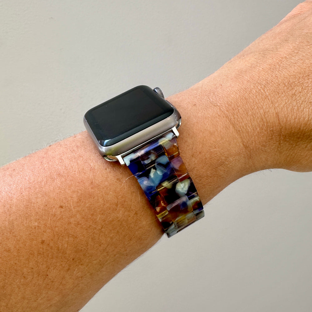 woman wearing acrylic Apple Watch Band in Serving Looks purple amber and light blue