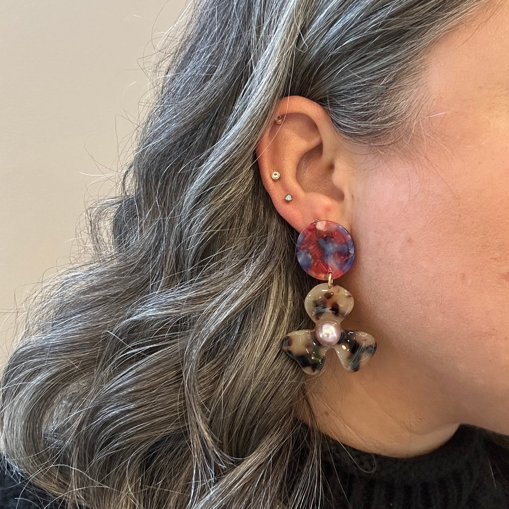 woman wearing acrylic Flower Drop Earrings in red, purple and blonde tortoise