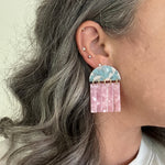 woman wearing acrylic Fringe Earrings in blue and pink