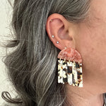 woman wearing acrylic Fringe Earrings in nougat brown, cream and pink