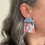 woman wearing acrylic Fringe Earrings in pink and blue