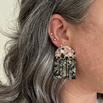 woman wearing acrylic Fringe Earrings in pink, black and beige