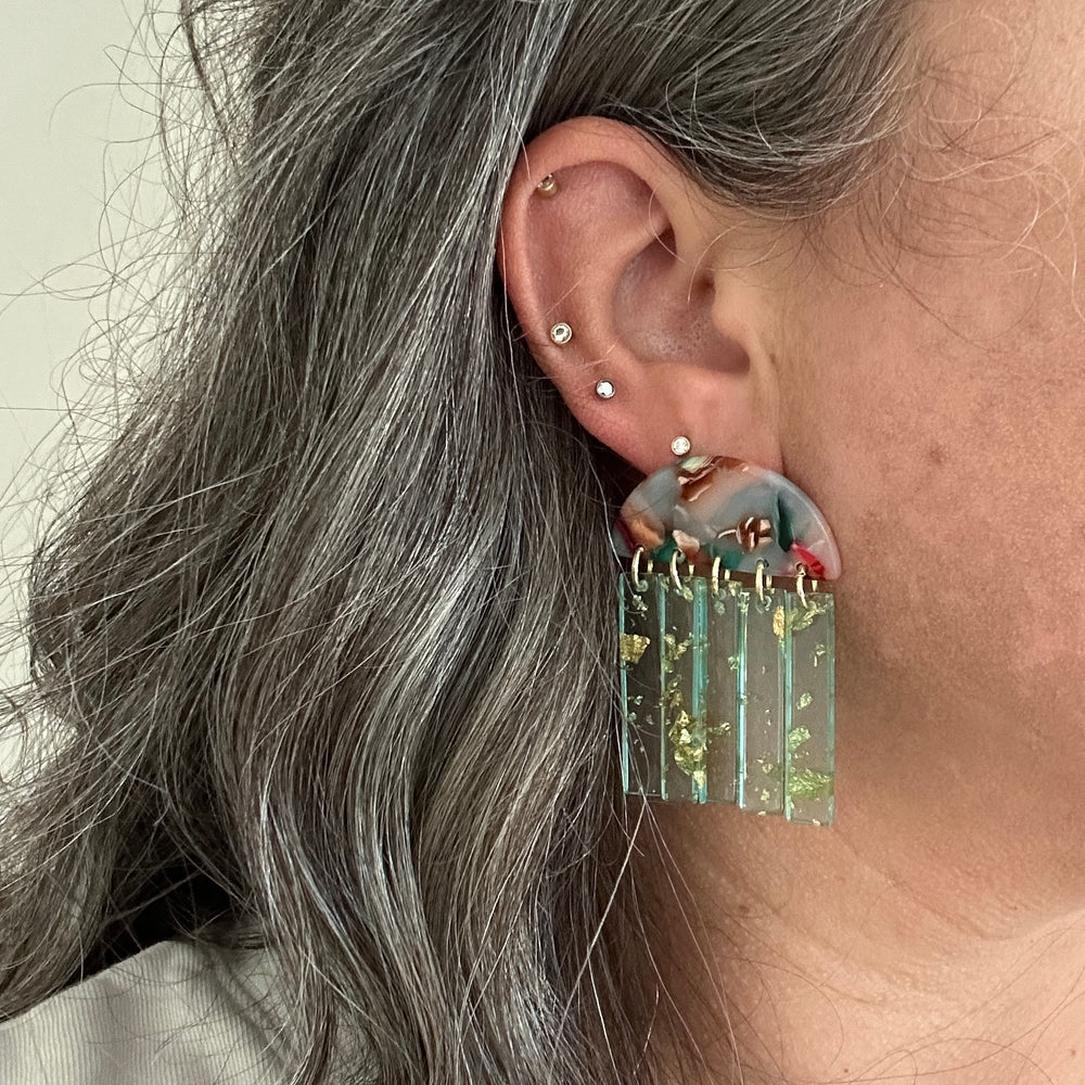 woman wearing acrylic Fringe Earrings in pink, green and brown