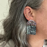 woman wearing acrylic Fringe Earrings in purple, black and gray