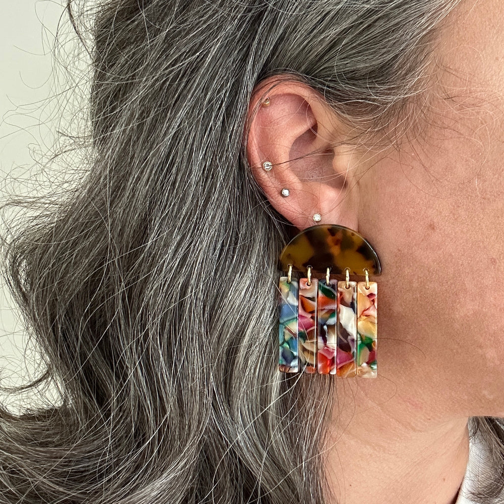 woman wearing acrylic Fringe Earrings in tortoise and multicolor