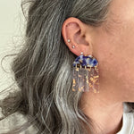 woman wearing acrylic Fringe Earrings in yellow, purple and gold