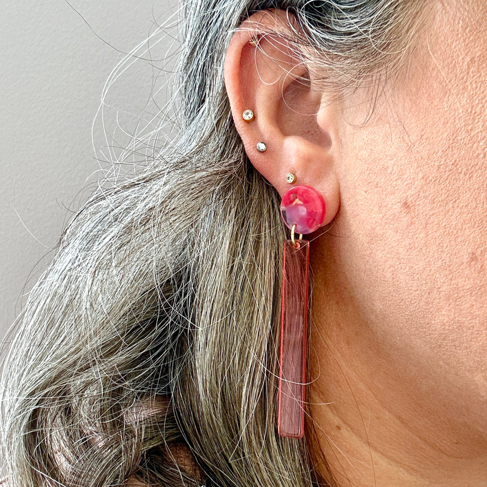 woman wearing acrylic Matchstick Drop Earrings in Hot red and pink