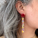 woman wearing acrylic Matchstick Drop Earrings in Magenta Me Crazy yellow, magenta and lilac