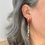 woman wearing acrylic Matchstick Drop Earrings in Red Hot Chili Pepper red, green and white