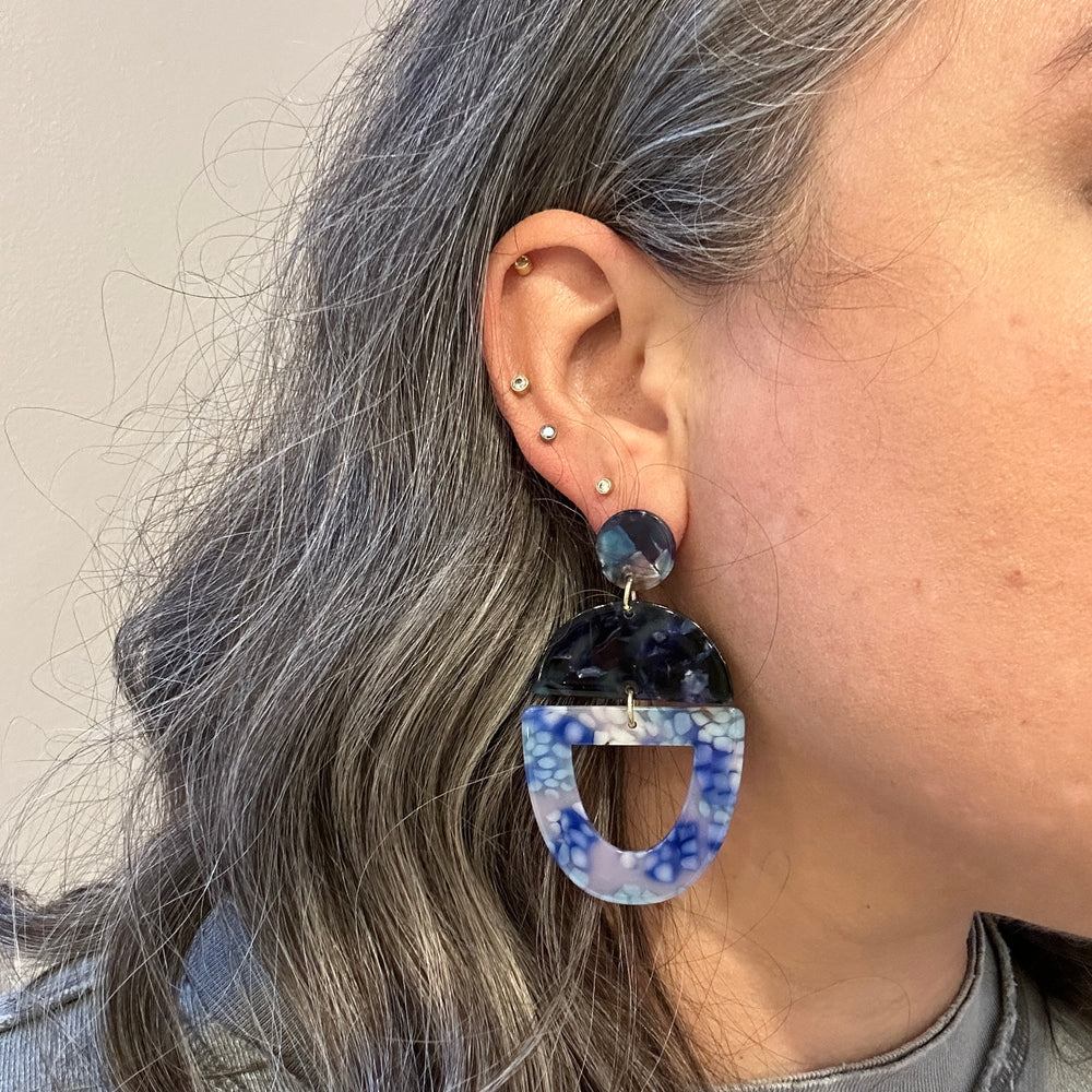 woman wearing acrylic Open Tab Drop Earrings in blue