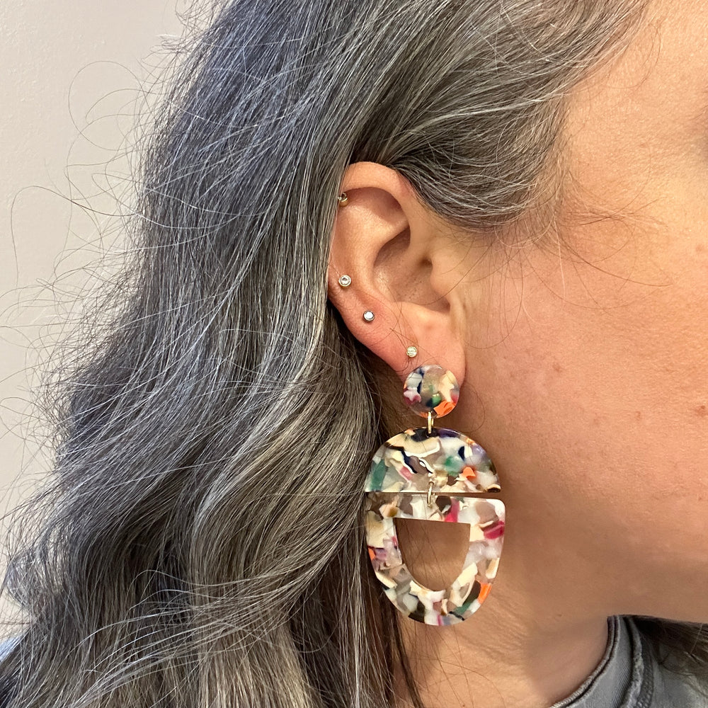 woman wearing acrylic Open Tab Drop Earrings in multicolor